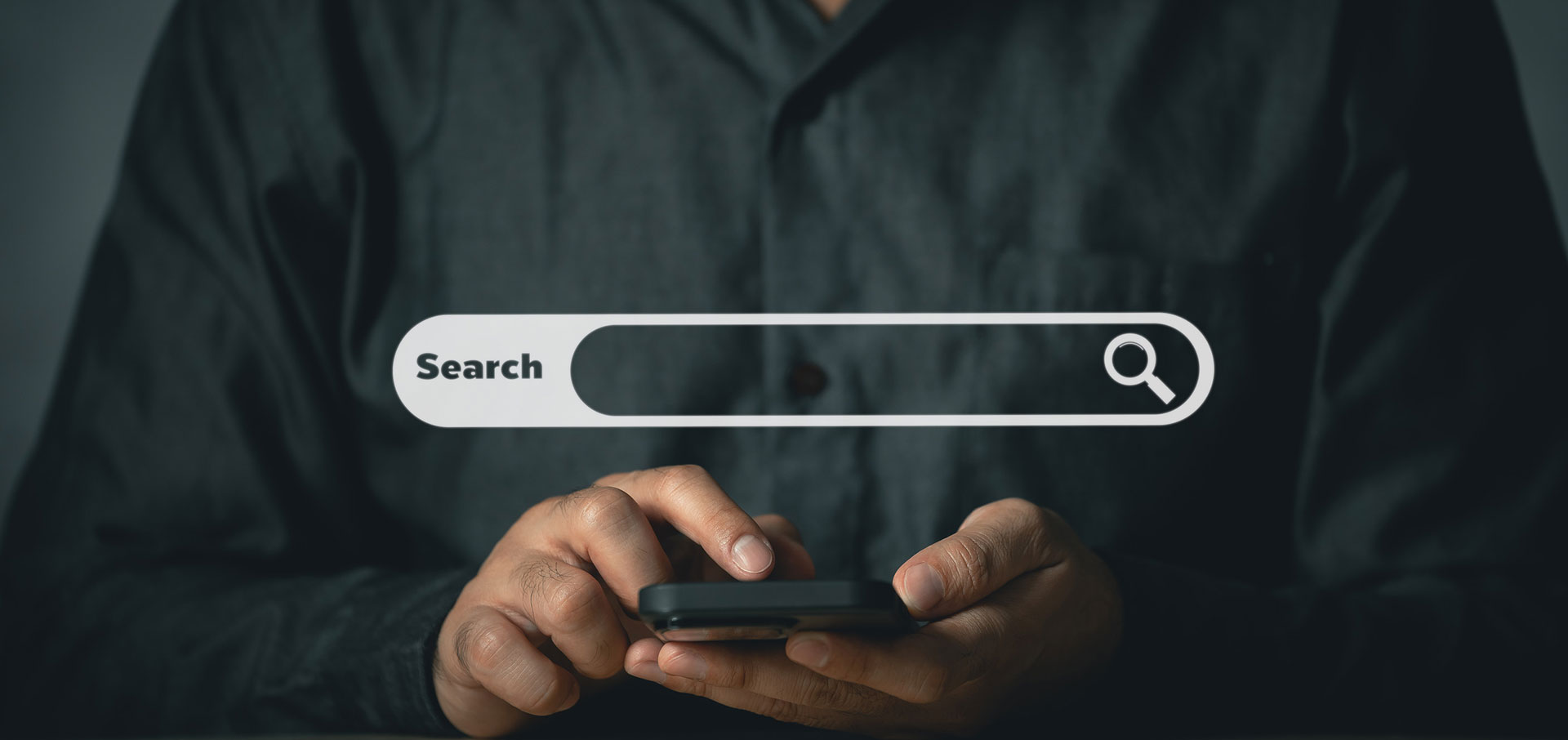 Man Searching on Mobile Phone